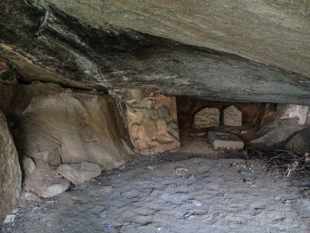 The Interiors of Cave. On the far end we can see few sculptures, one of them shows a warrior on a horse.